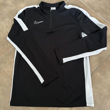 Top sportivo Nike con zip