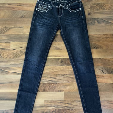 A. Idol Skinny Jeans
