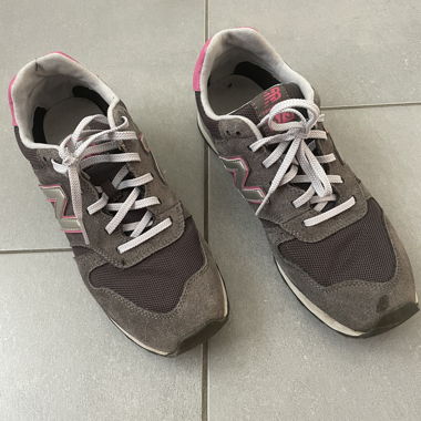 Grey and pink New Balance sneakers