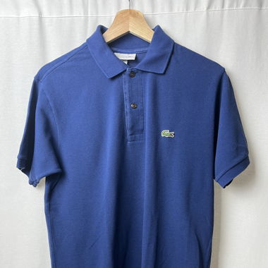 Polo Lacoste bleu parfait état 