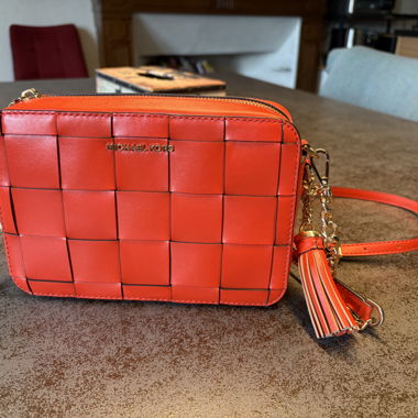Michael Kors orange woven crossbody bag
