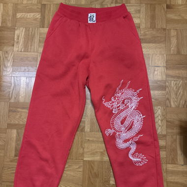 Pantalone da jogging rosso con motivo drago