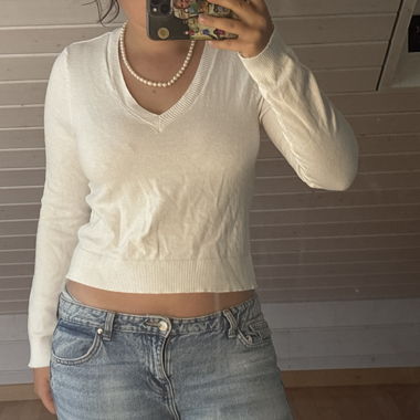 Maglione con scollo a V bianco