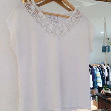 Top da donna bianco con motivo floreale