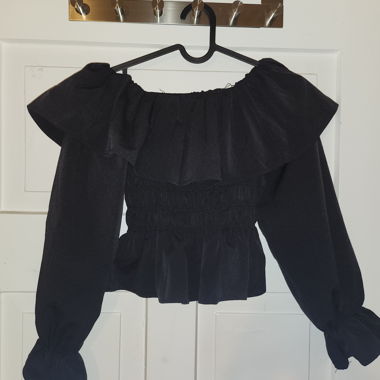 Black blouse with ruffles