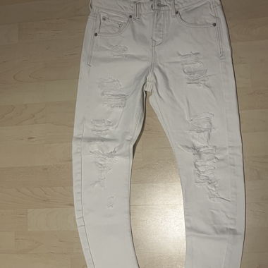 Jeans skinny blancs avec des trous