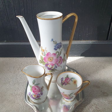 Tea set with flowers and saucer