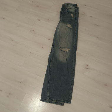 Jeans baggy strappati 