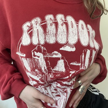 Red jumper with white print