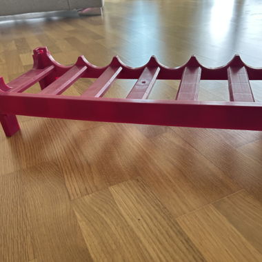 Red plastic wine rack