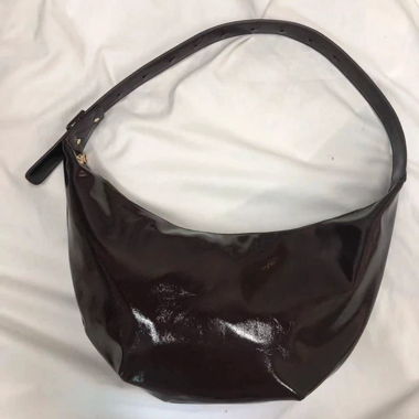 A fashionable shiny leather shoulder bag