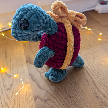 Present dinosaur crochet plushie 