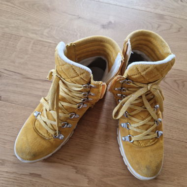 Yellow winter boots with lug sole