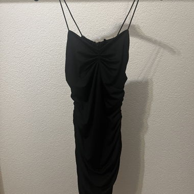 Mini robe noire moulante - Taille S - État neuf!