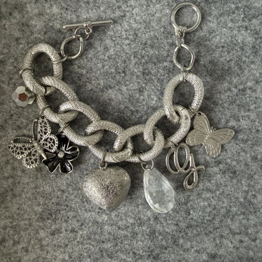 Bracciale charm Guess colore argento