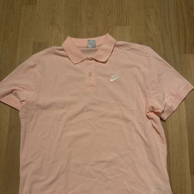 pink Nike polo shirt