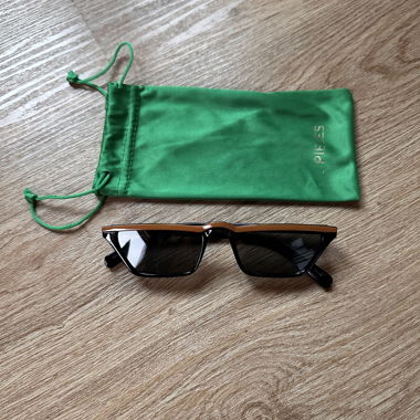 Rectangular black sunglasses with dark yellow rim