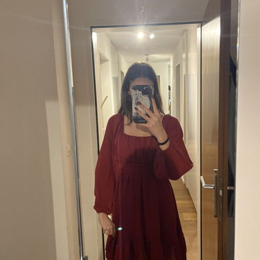 Burgundy long-sleeve mini dress with bow back