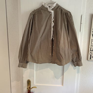 Blusa a quadri con ruches