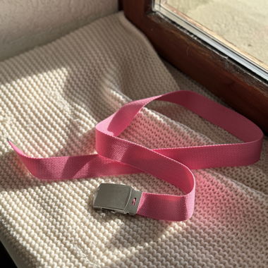 Pink belt with metal buckle