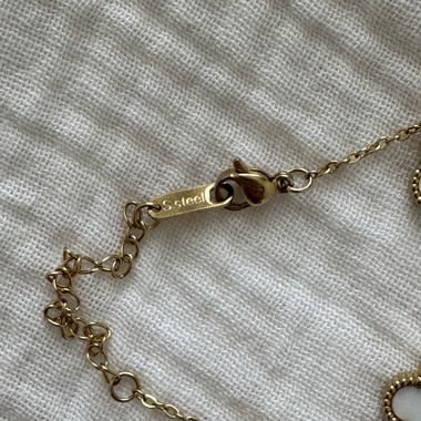 Collana e bracciale con quadrifoglio color oro