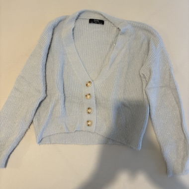 Maglione con bottoni