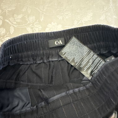 Pantaloni casual C&A neri a sottili righe
