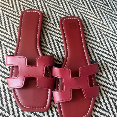 Red H-style slide sandals