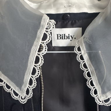 Bibiy. black ruffle vest