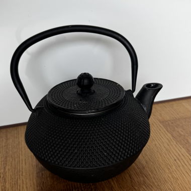 Black cast-iron teapot