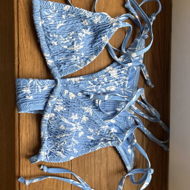 Light blue bikini top with floral pattern