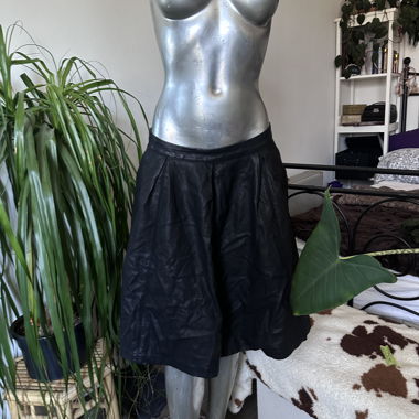 Black flared faux-leather mini skirt