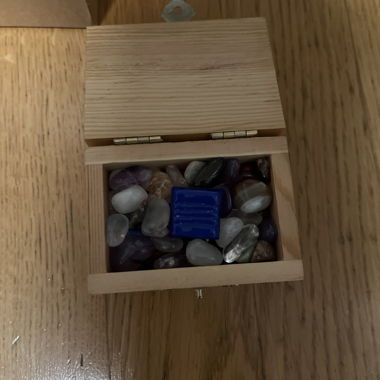 Wooden box with stones