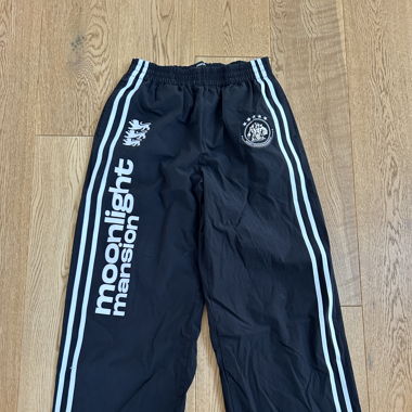 MOONLIGHT MANSION TRACKPANTS