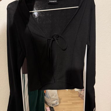 Black long-sleeve top with ties