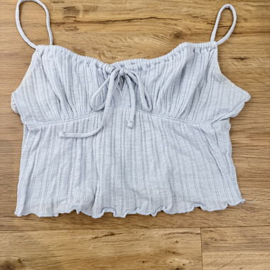 Top court bébé bleu avec nœud