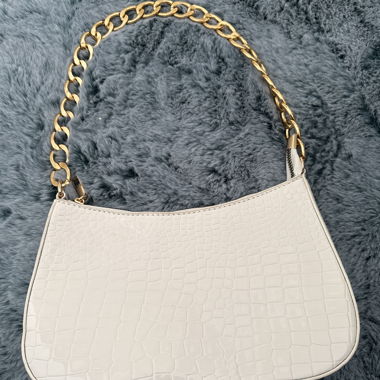 White handbag with gold chain