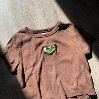 Brown crop top with heart appliqué