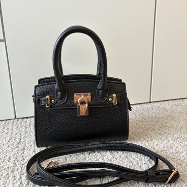 Mini black handbag with gold details