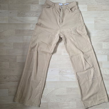 Pantaloni beige a gamba larga