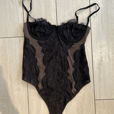 Black lace women's bodysuit with brown inserts