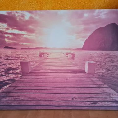Tableau sur toile coucher de soleil avec pont au bord de la mer