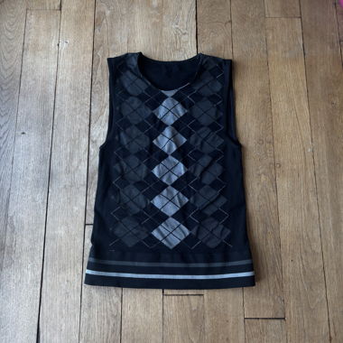 Top in maglia nero senza maniche a motivo argyle