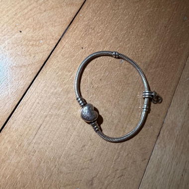 Silver-coloured Pandora bracelet with heart charm