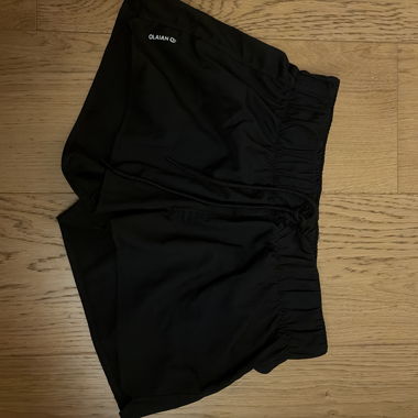 Pantaloncini sportivi neri OLAIAN