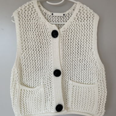 White crocheted vest with buttons