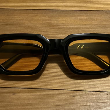 Black sunglasses with orange lenses