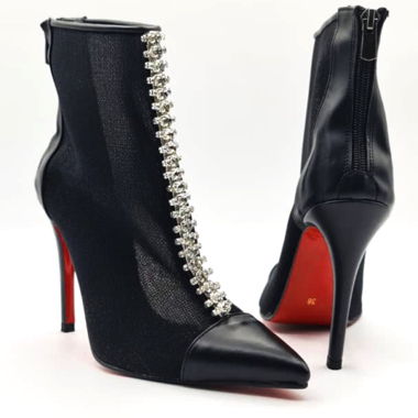 Black ankle boots with red soles