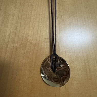 Necklace with round metal pendant