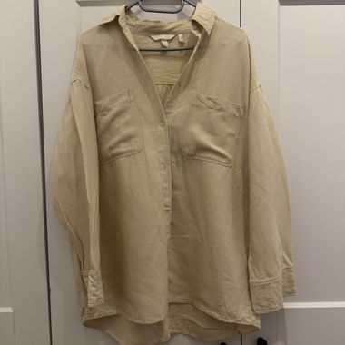 Beige oversized shirt with pockets